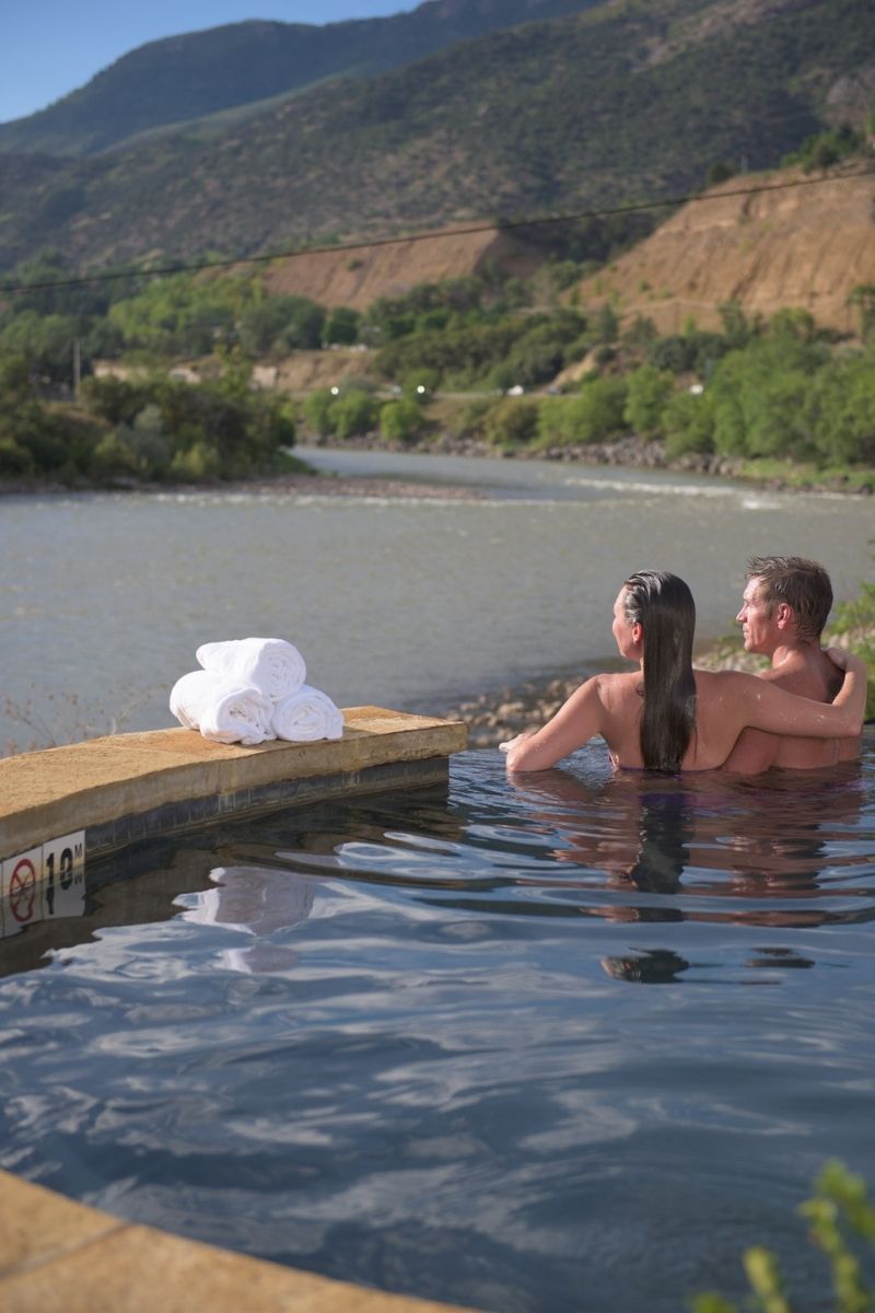 couple relaxing in the water at ironwood hot springs