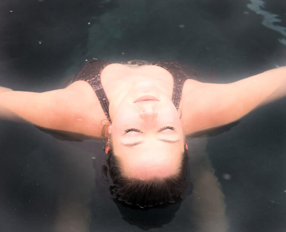 Woman soaking in mineral pool at Iron Mountain Hot Springs