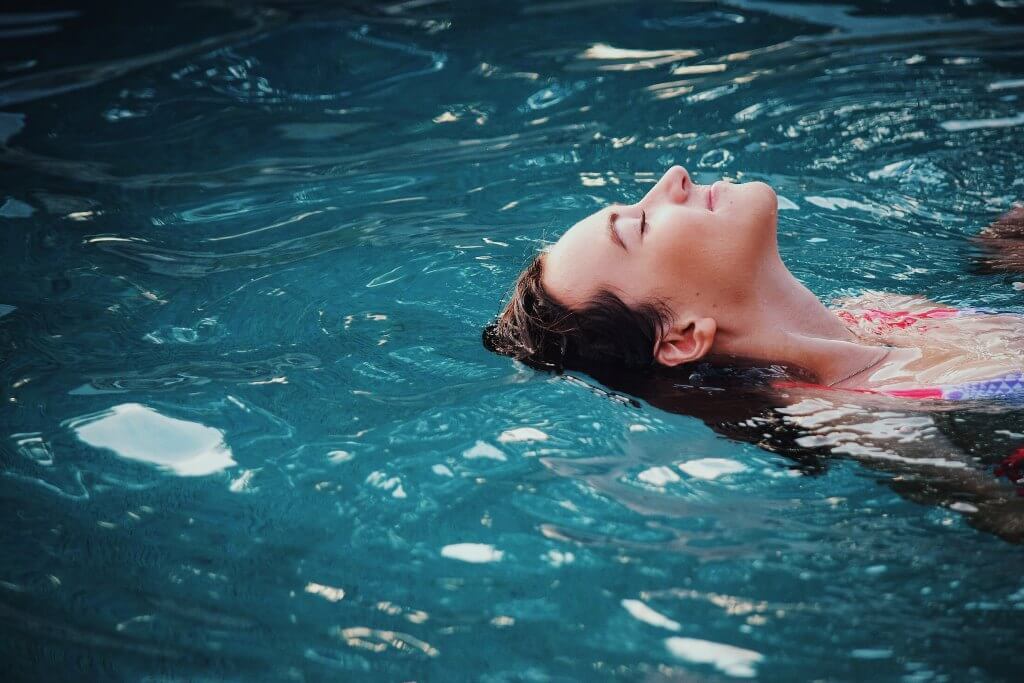 Woman soaking in warm water