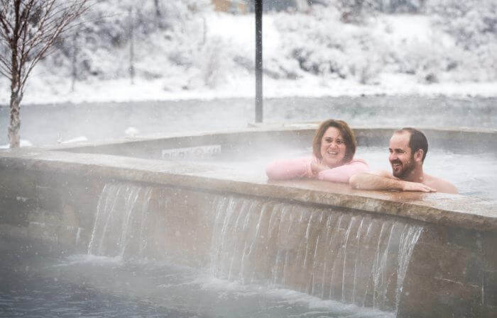 couple soaking at Iron Mountain Hot Springs