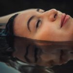Woman soaking in hot springs